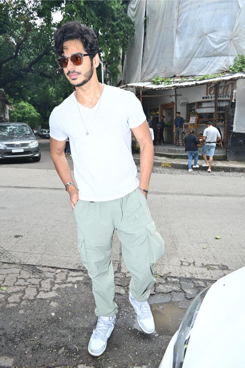  Dressed in a white t-shirt and green cargos, paired with stylish sunglasses, Ishan exuded a cool and laid-back vibe. 